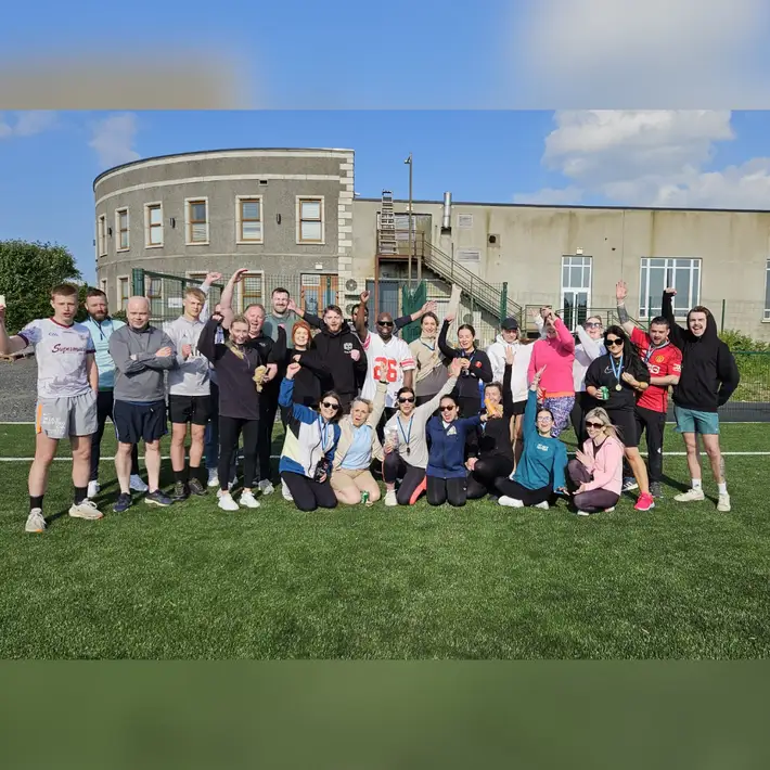 Group photo of team on astro turf