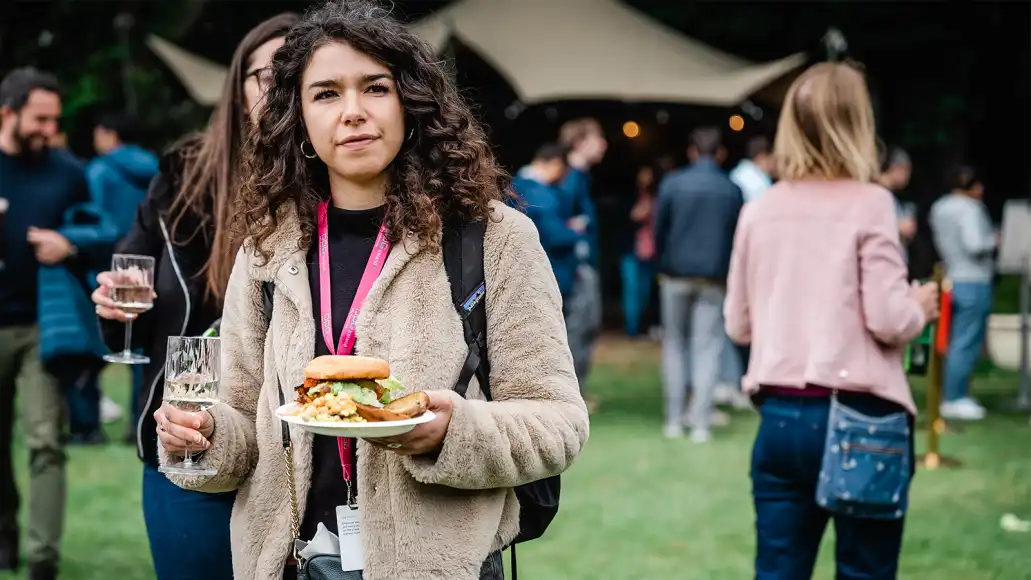 Team building in Carlow with colleagues networking while enjoying food and drinks at an outdoor event