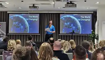 facilitator presenting to a group about to take on the experiential learning team training event detour in ireland