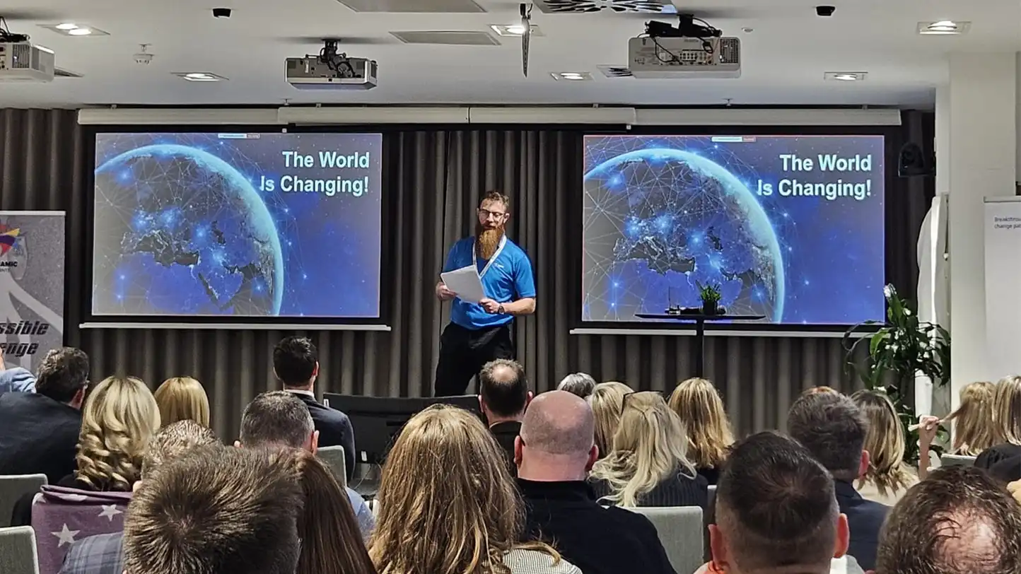 facilitator presenting to a group about to take on the experiential learning team training event detour in ireland