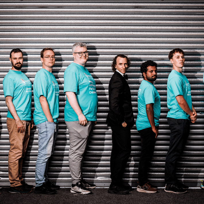 Colleagues posing for a Halloween-themed team photo during the hunt.
