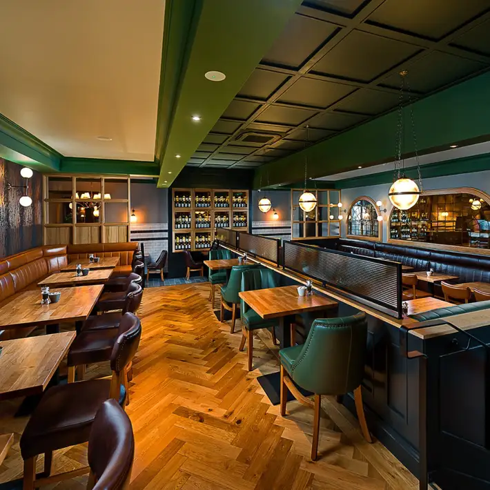 Underground cellar bar with green seating and woof flooring | Plan your Corporate Team-Building at Kilmurry Lodge Hotel | Dynamic Events