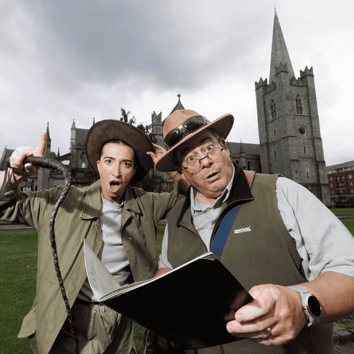 Actors posing infront of st.patricks cathedral dressed up as jungle explorers