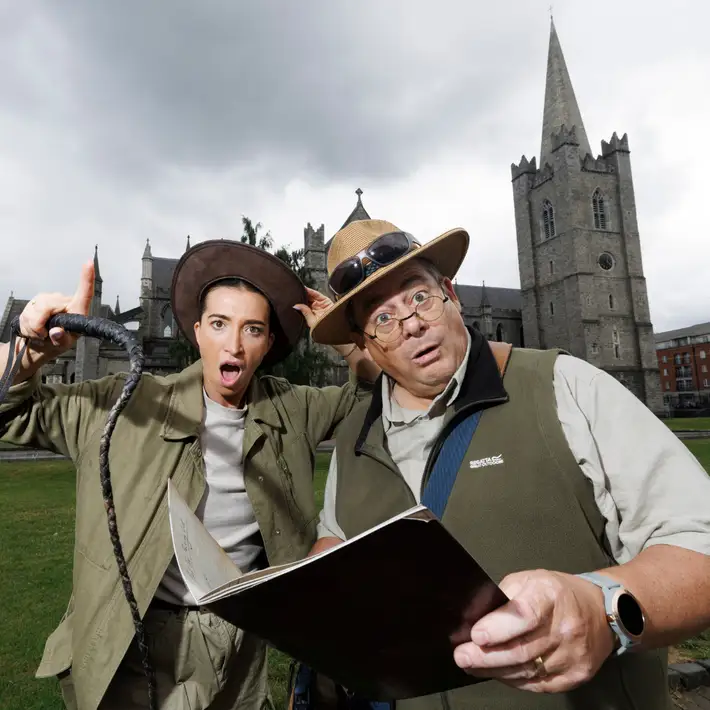 Actors posing infront of st.patricks cathedral dressed up as jungle explorers