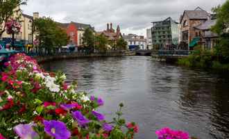 View of Sligo town with the Garavogue River and colourful flowers, popular setting for corporate events and team building in the west of Ireland