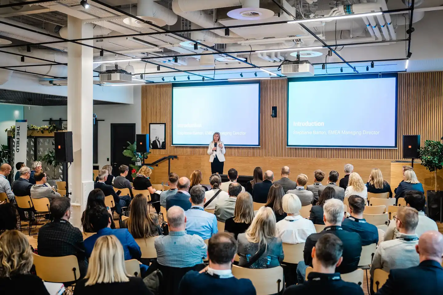 Corporate away day event with keynote speaker presenting to employees in a modern Dublin conference venue