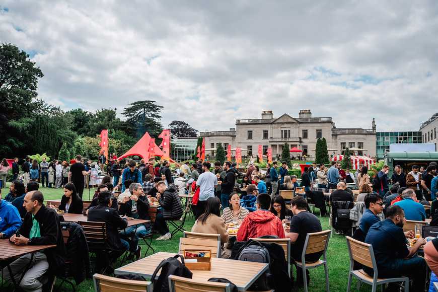 Corporate team building event in Carlow with employees socialising and enjoying food outdoors