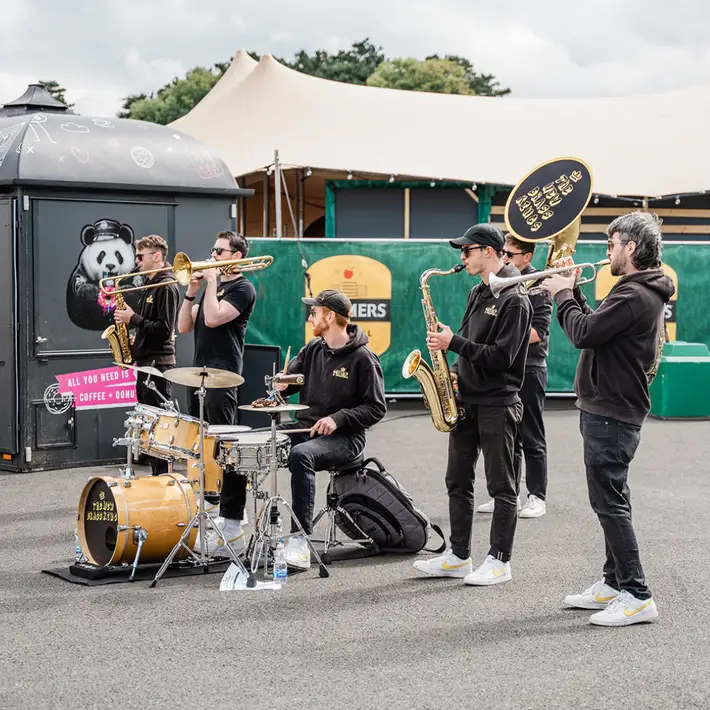 Brass band entertaining guests in the sunshine