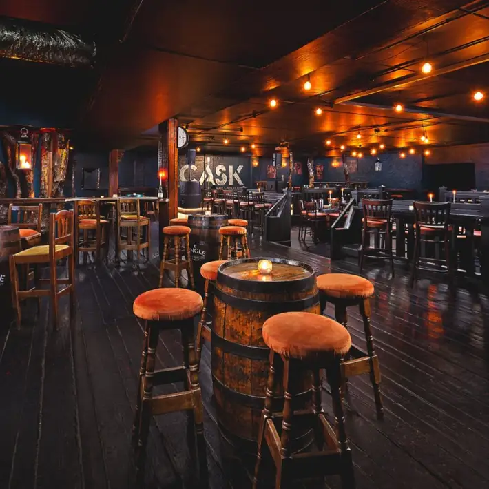 Cask cellar bar, trendy vibes with intimate spot lights and dark surroundings with live stage and a lot of seating with mainly bar stools and high tables | Plan your Corporate Team-Building at Kilmurry Lodge Hotel | Dynamic Events 