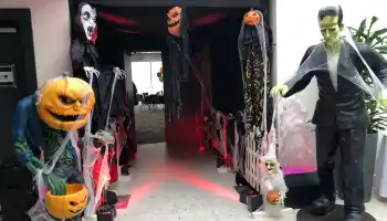 Halloween themed corporate event entrance with pumpkin heads, Dracula and Frankenstein statues for company family day in Ireland