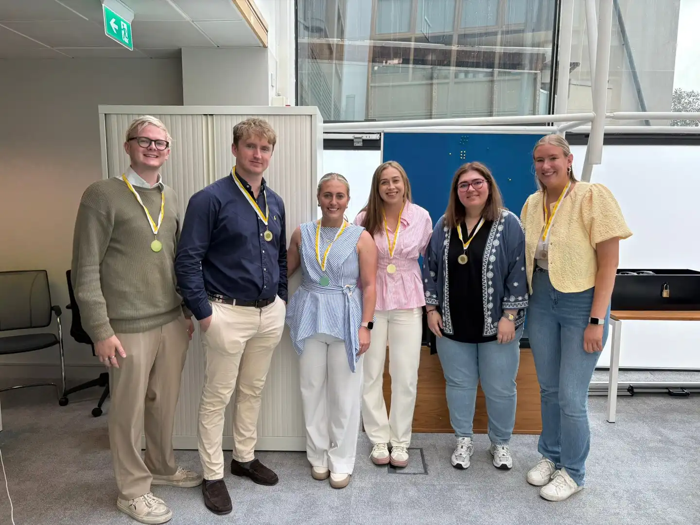 Group of people at an onboarding event talking amongst themselves 