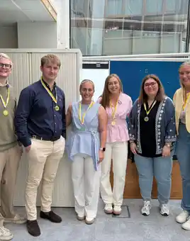 Group of people at an onboarding event talking amongst themselves 