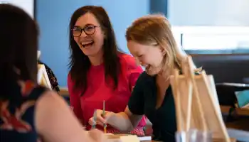 small team collaborating during a hands-on team building activity in ireland