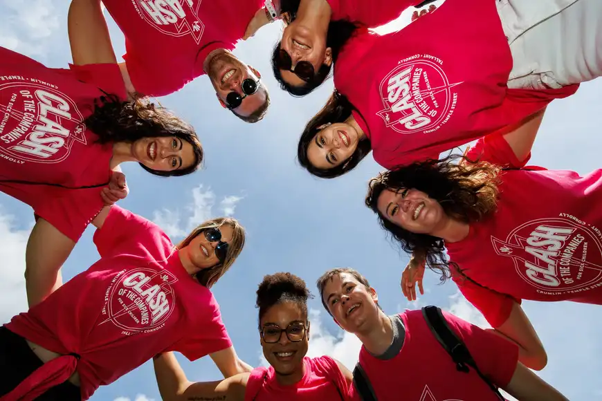 Outdoor corporate team building huddle at event in Ireland