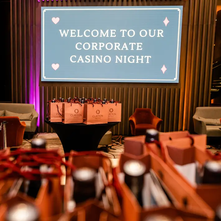 Corporate casino night sign with clayton hotels goodybags