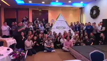 group of people with cardboard pyramid