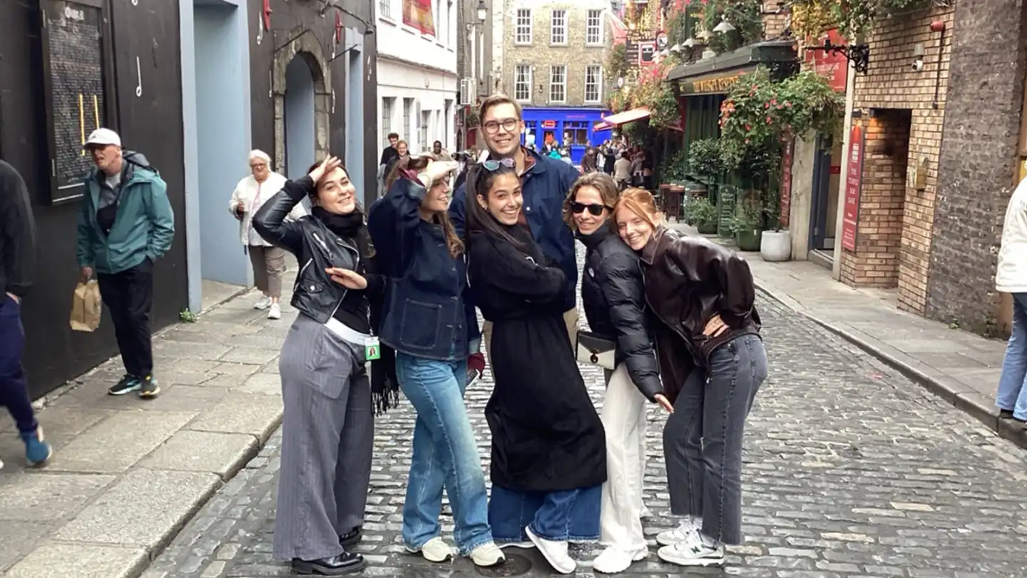 Salesforce graduates posing together in Temple Bar Dublin during onboarding Digital Treasure Hunt team building activity