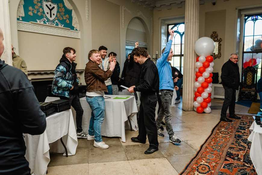 happy team winning their team building activity during the kick off day in ireland