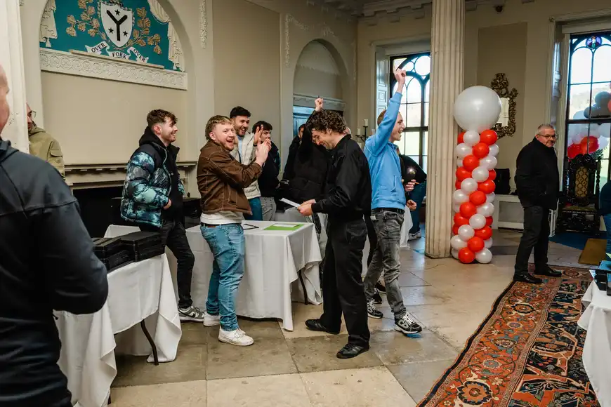 happy team winning their team building activity during the kick off day in ireland