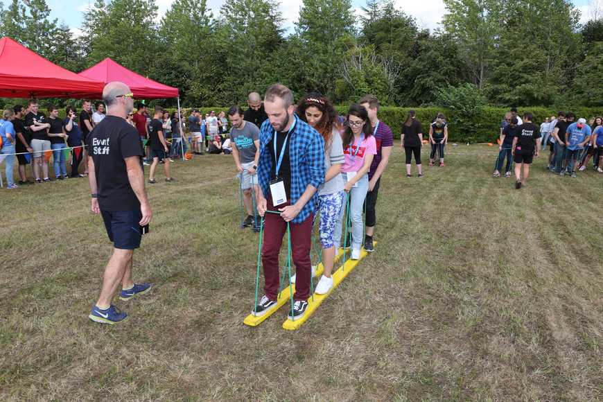 Outdoor team building relay game in Shannon with colleagues working together