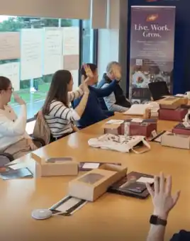 ABP Food Group graduates joining a multi location digital treasure hunt across Ireland and the UK, with a remote event host briefing teams live over video call.