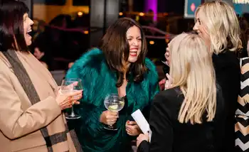 Guests laughing and chatting at a corporate networking event at Clayton Hotel Cardiff Lane in Dublin.