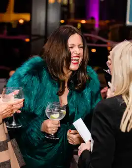 Guests laughing and chatting at a corporate networking event at Clayton Hotel Cardiff Lane in Dublin.