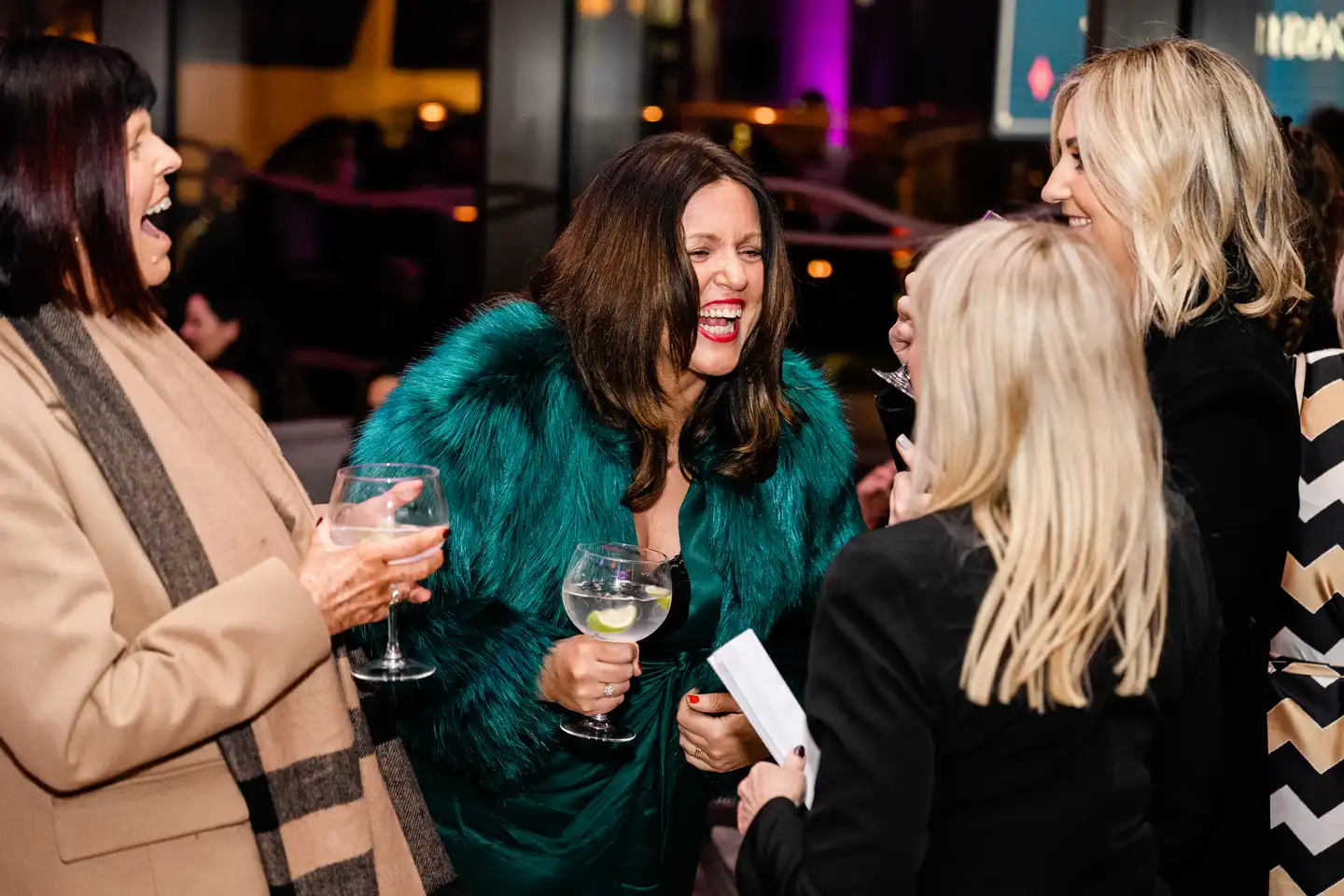 Guests laughing and chatting at a corporate networking event at Clayton Hotel Cardiff Lane in Dublin.