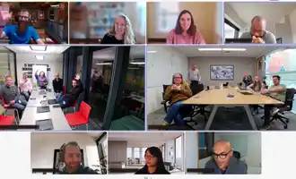 Hybrid team building activity showing remote and office employees working together affordably