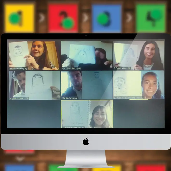 Employees on a video call showing their drawings during an online team building activity as part of a Virtual Away Day event.