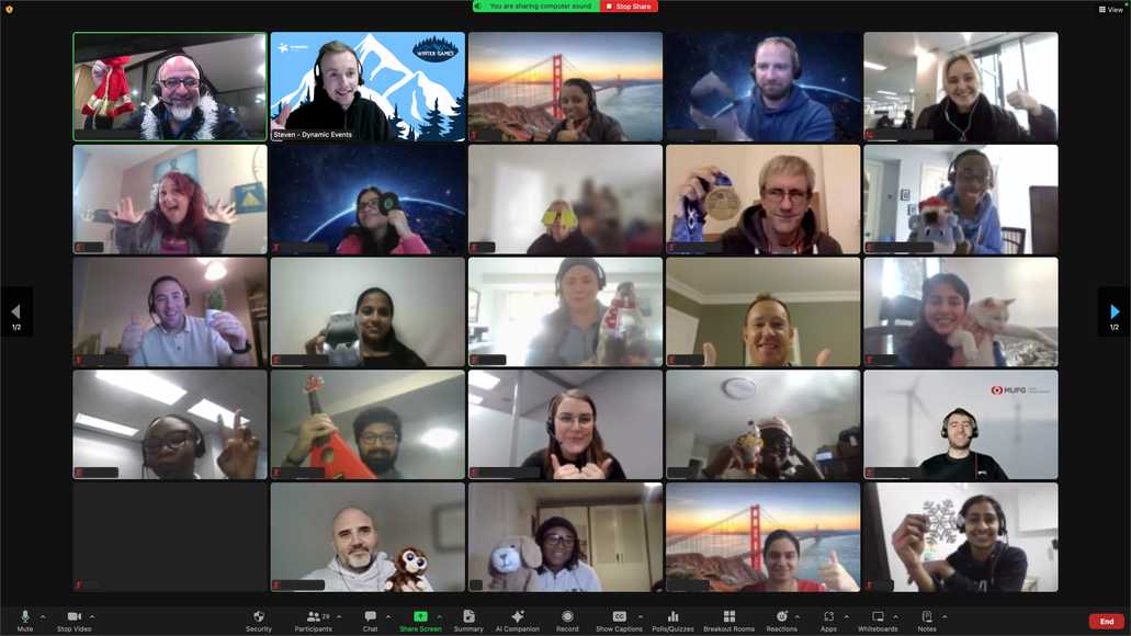 Corporate team giving thumbs up during winter games virtual team building activity on Zoom