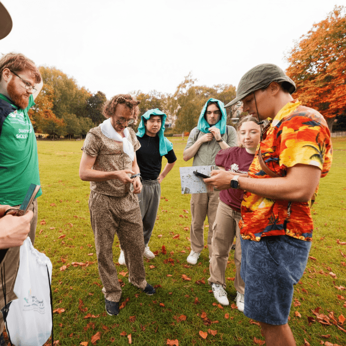 Participants celebrating at the end of a Halloween digital treasure hunt.