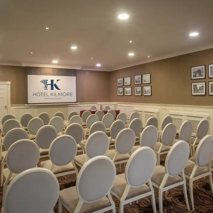 Meeting room with theatre-style seating and presentation screen at Hotel Kilmore in Cavan