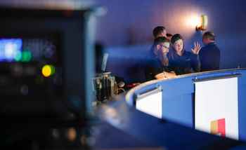 Dynamic Events team members discussing event production details during a corporate event in Ireland.