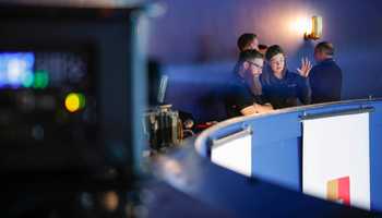 Dynamic Events team members discussing event production details during a corporate event in Ireland.