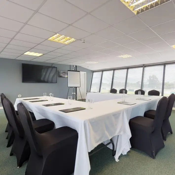 classroom set up with the seats and tables 