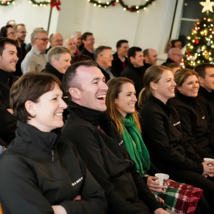 Corporate group enjoying a festive treasure hunt showback session during a Christmas team building event in Ireland
