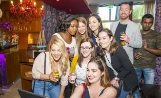 group taking selfie with ipad
