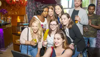 group taking selfie with ipad
