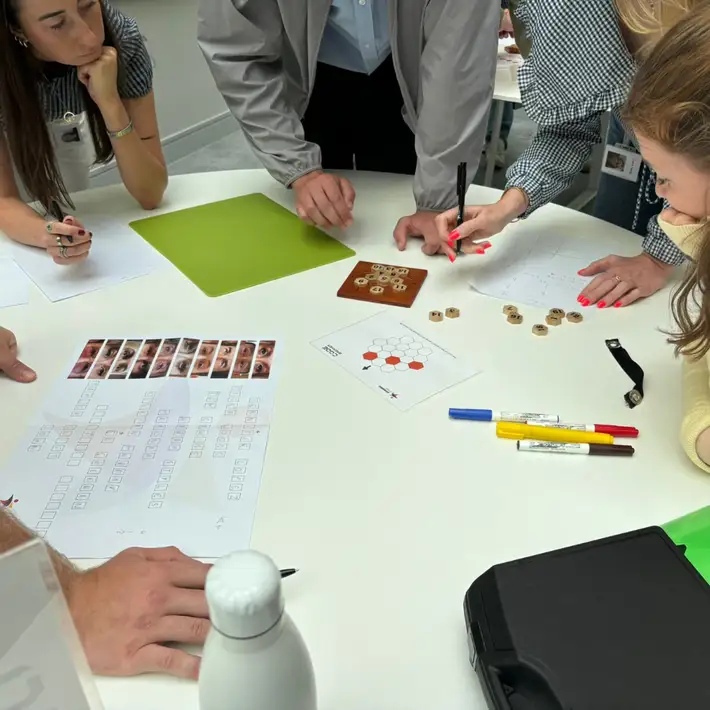 Group of Ornua graduates working together during a team-building challenge at their onboarding session.