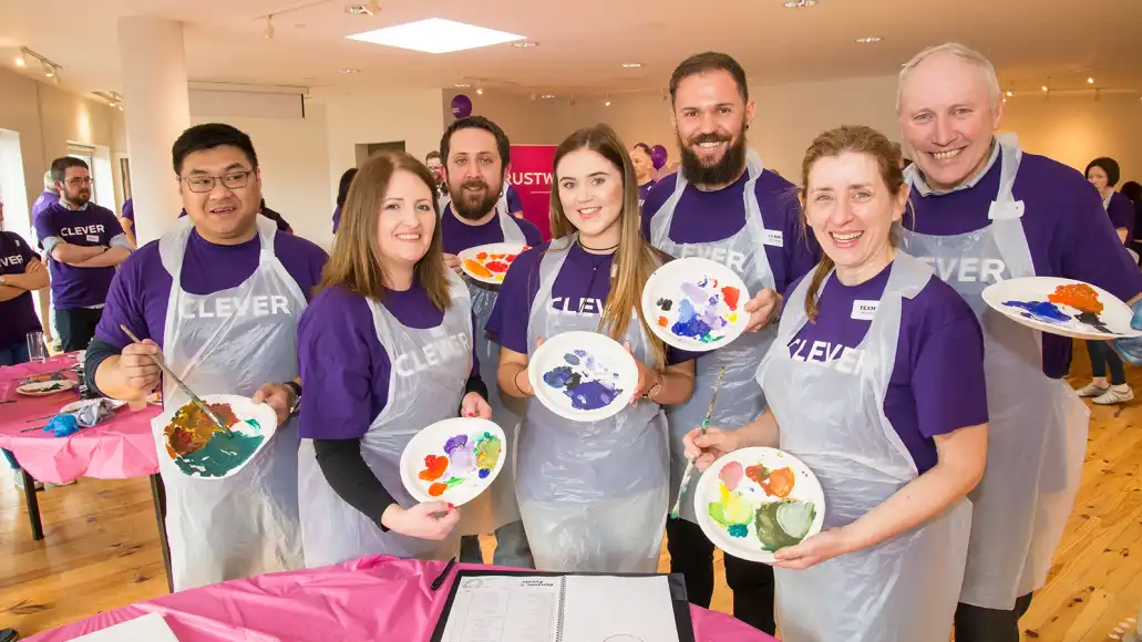 Public sector employees in Ireland participating in a Big Picture team building workshop, painting and collaborating together.