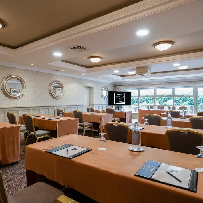 school desk set up at corporate meeting