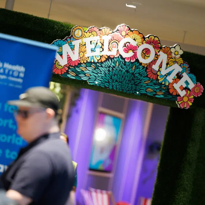 Welcome sign with archway for participants 