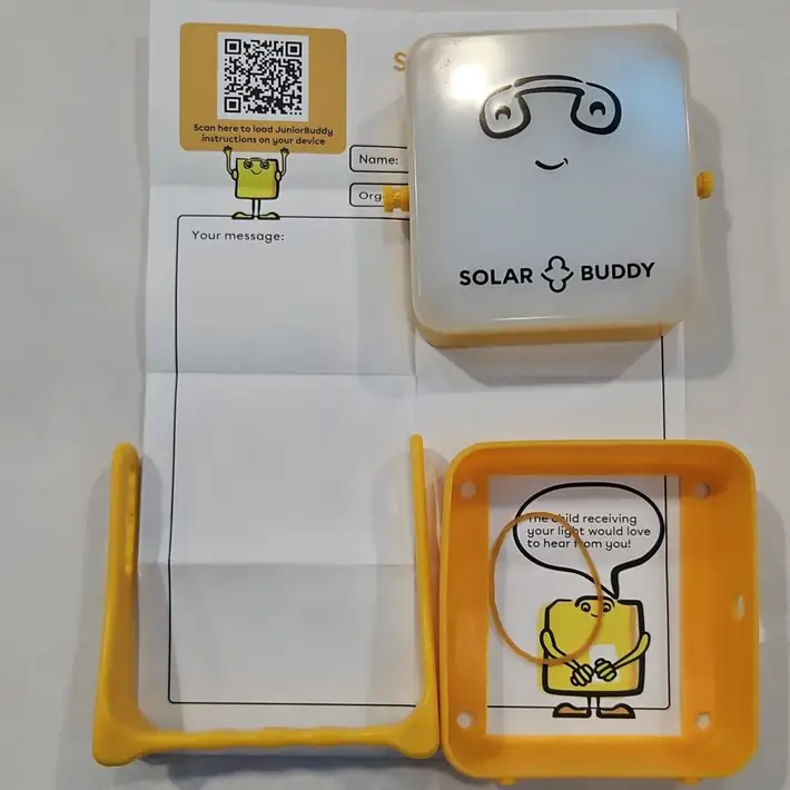 A close-up of SolarBuddy components laid out on a table, prepared for the assembly activity.