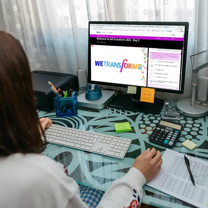 woman looking at computer screen