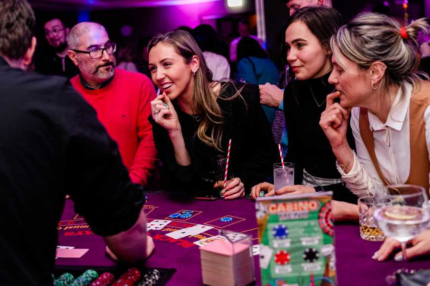 Corporate group enjoying a casino-style indoor entertainment event