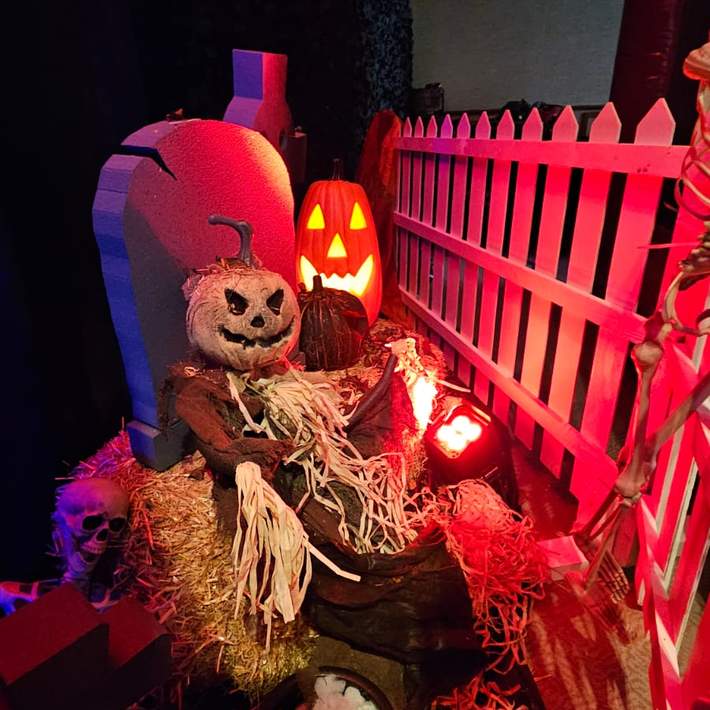 White fence with skeleton and Pumpkin