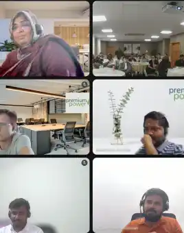 Hybrid team building event for Premium Power staff with Dynamic Events showing in person participants in a Dublin meeting room and remote employees joining through Google Hangouts for a shared escape game experience