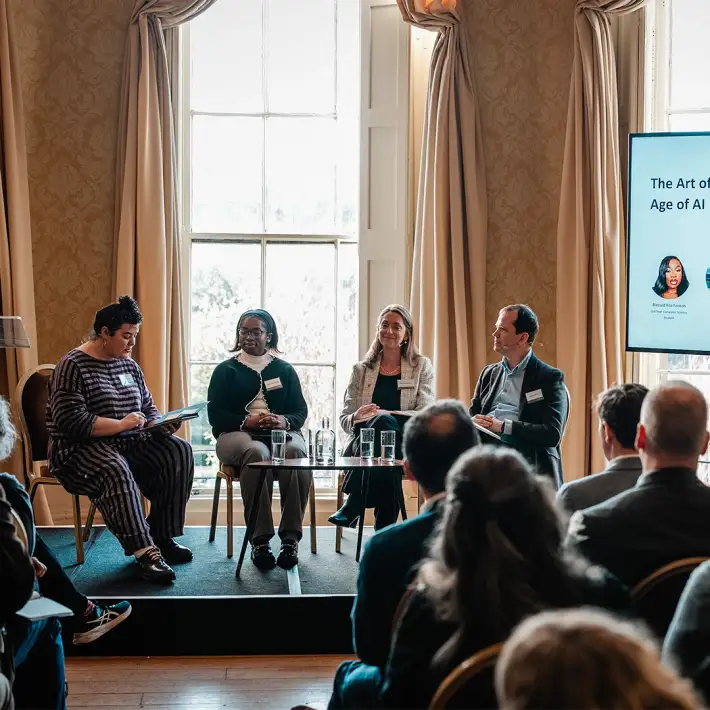 Panel discussion on stage during the Microsoft conference with full audience and event staging