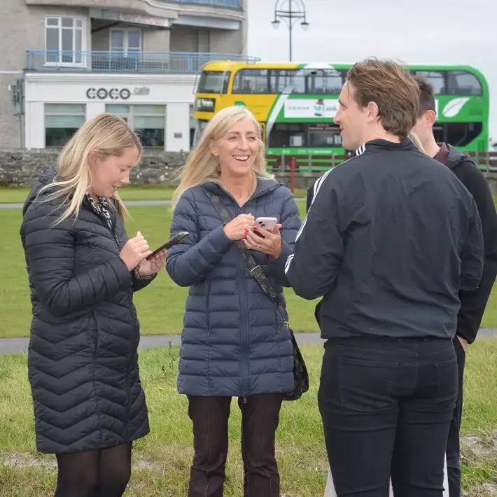 Team members outside in Galway taking part in a Remote Host Digital Treasure Hunt corporate team building activity